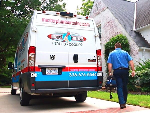 a man riding on the back of a truck
