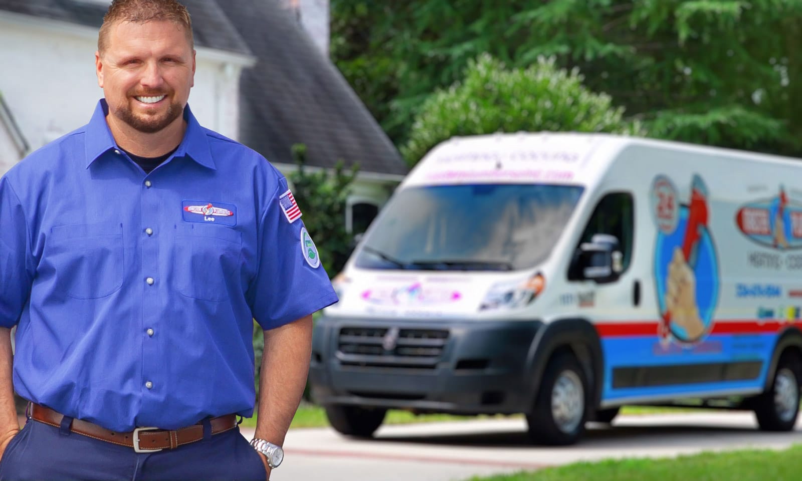 a man standing in front of a blue car